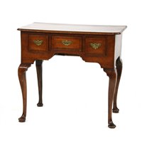 Lot 526 - An early George II oak and crossbanded lowboy