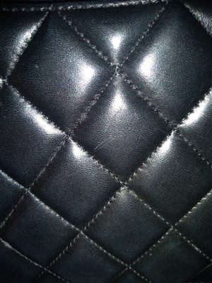 Lot 742 - A Chanel classic single flap black leather maxi handbag