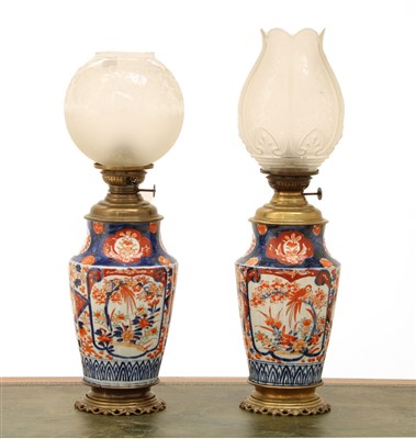 Lot 356 - A pair of Imari vase oil lamps