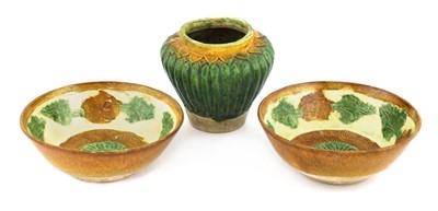 Lot 334 - A pair of Chinese sancai bowls