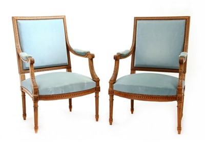 Lot 235 - A pair of French walnut fauteuils