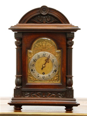 Lot 335 - An Edwardian walnut mantel clock