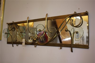 Lot 123 - A mirrored brass coat rack