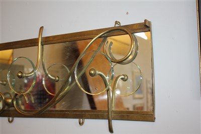 Lot 123 - A mirrored brass coat rack