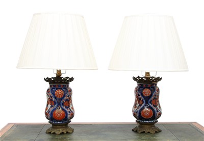 Lot 405 - A pair of Imari vase table lamps