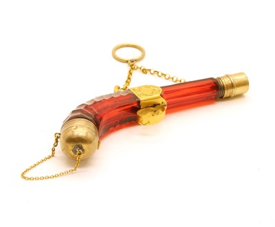 Lot 40 - A Victorian novelty gilt metal mounted 'pistol' vinaigrette and scent bottle