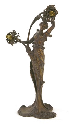 Lot 823 - An Art Nouveau spelter two-light table lamp