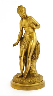 Lot 195 - A gilt bronze figure holding a dove