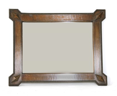 Lot 268 - An Arts and Crafts oak wall mirror