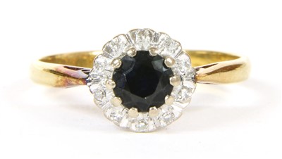 Lot 16A - A sapphire and diamond cluster ring