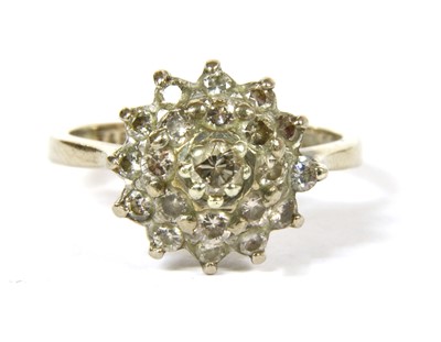 Lot 5B - An 18ct white gold three tier diamond cluster ring