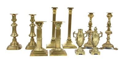 Lot 325 - Four pairs of brass candlesticks
