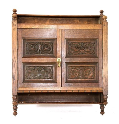 Lot 270 - An oak hanging cupboard