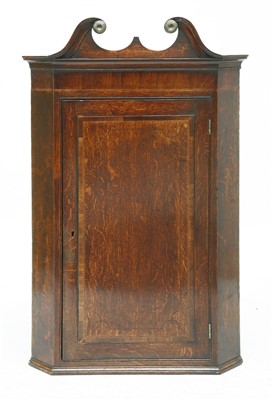 Lot 350 - A George III strung and crossbanded oak hanging corner cabinet