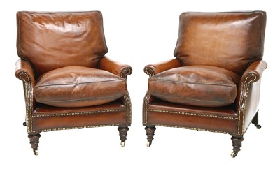 Lot 164 - A pair of brown leather armchairs