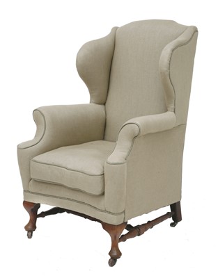 Lot 411 - A wing armchair
