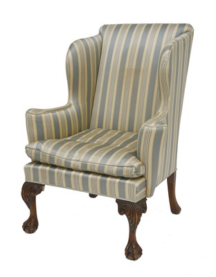 Lot 323 - A wing armchair