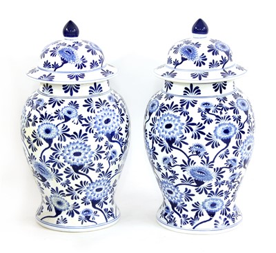 Lot 306 - A pair of Chinese blue and white baluster vases and covers