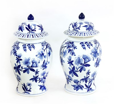 Lot 307 - A pair of Chinese blue and white baluster vases and covers