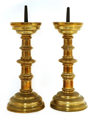 Lot 315 - A pair of Flemish brass pricket candlesticks