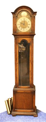 Lot 272 - A 1930s oak longcase clock