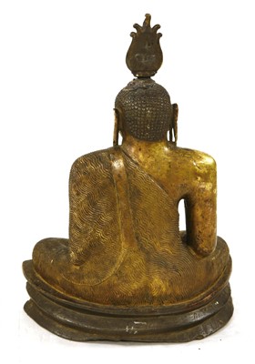 Lot 564 - A gilt bronze figure of Buddha