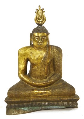 Lot 564 - A gilt bronze figure of Buddha
