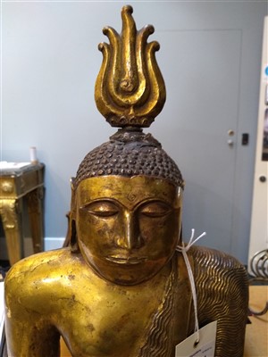 Lot 564 - A gilt bronze figure of Buddha