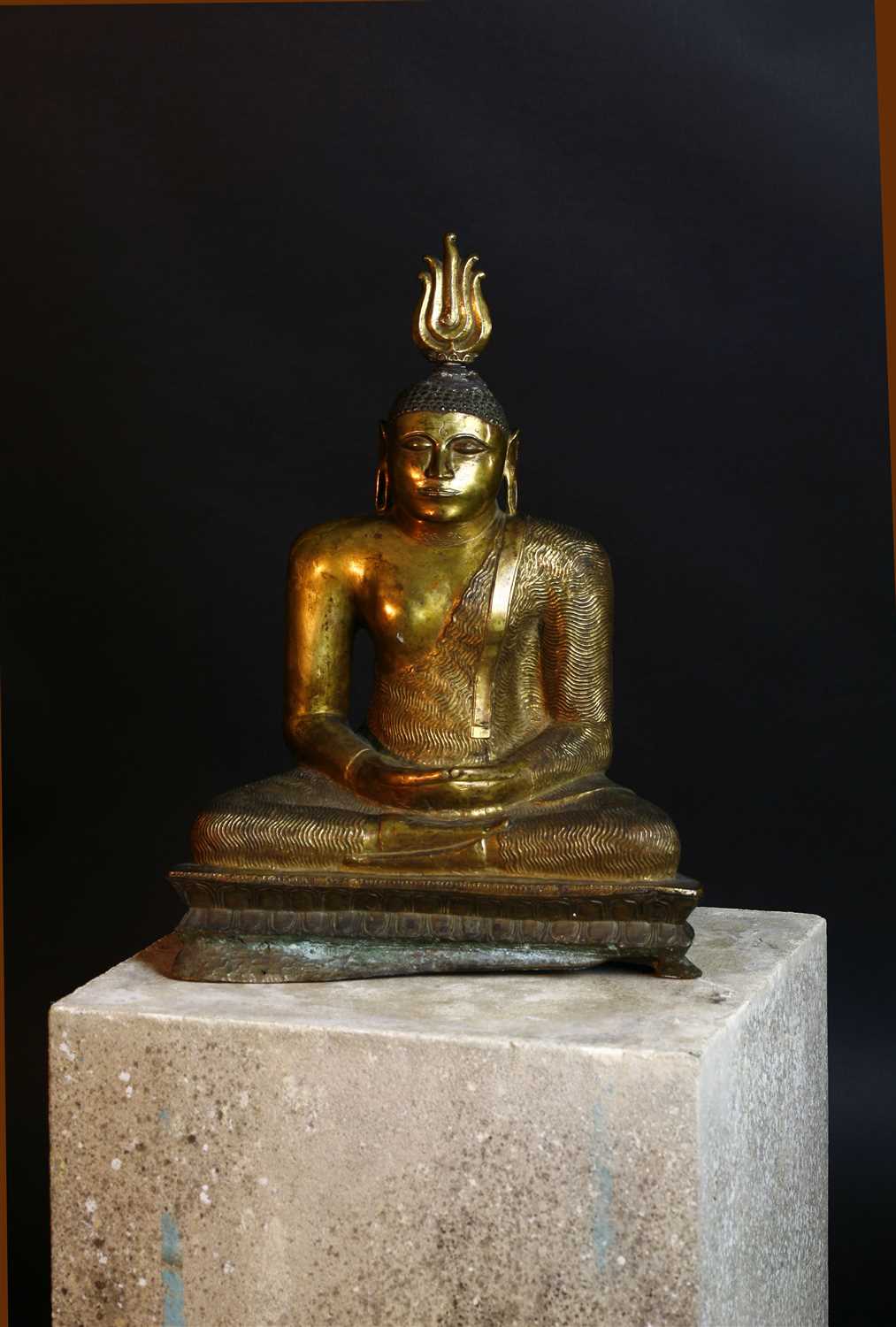 Lot 564 - A gilt bronze figure of Buddha