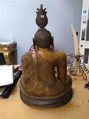 Lot 564 - A gilt bronze figure of Buddha
