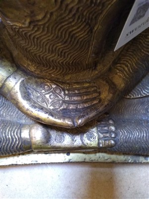 Lot 564 - A gilt bronze figure of Buddha
