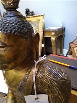 Lot 564 - A gilt bronze figure of Buddha