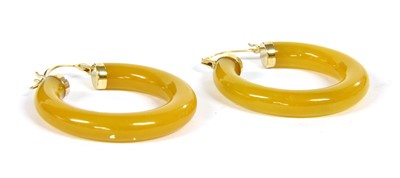 Lot 11A - A pair of carved jade hoop earrings