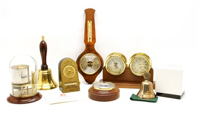 Lot 147 - A brass mounted barometer and clock