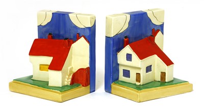 Lot 120 - A pair of Clarice Cliff cottage bookends