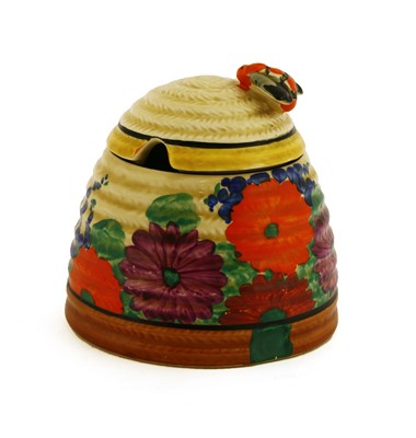 Lot 137 - A Clarice Cliff 'Gayday' Beehive honeypot and cover