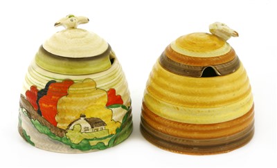 Lot 168 - Two Clarice Cliff beehive honeypots and covers