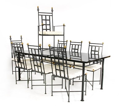 Lot 373 - A refectory style granite topped dining table and eight chairs