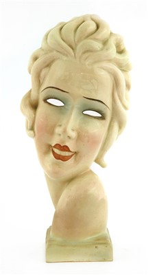 Lot 229 - An Art Deco pottery mask of a girl