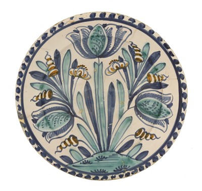 Lot 338 - A delft pottery blue dash charger