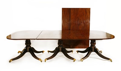 Lot 800 - A George III-style mahogany triple pillar dining table