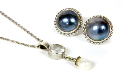 Lot 1050 - A pair of 9ct white gold grey mabé pearl earrings