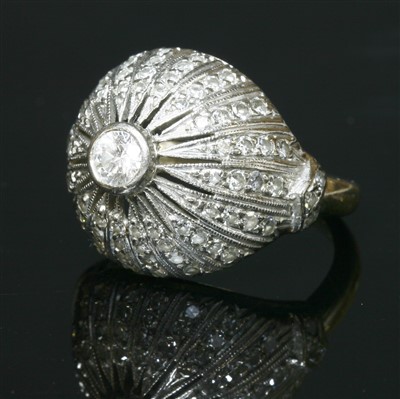 Lot 210 - A Continental diamond set bombé ring