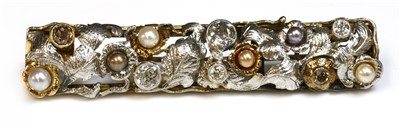 Lot 48 - A Continental two colour gold diamond, fancy diamond and pearl foliate plaque brooch, c.1935-1945