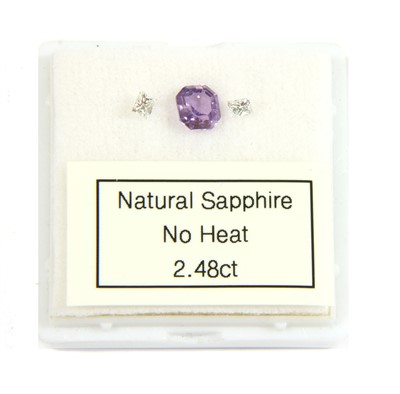 Lot 7 - A ring layout composed of three unmounted gemstones