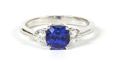 Lot 35 - An 18ct white gold three stone tanzanite and diamond ring