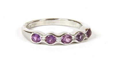 Lot 41 - An 18ct white gold sapphire and diamond half eternity ring