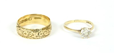 Lot 48 - An 18ct gold wedding band