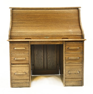 Lot 538 - An Edwardian oak roll top desk
