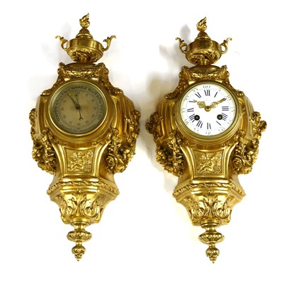Lot 166 - A French ormolu cartel clock and companion barometer